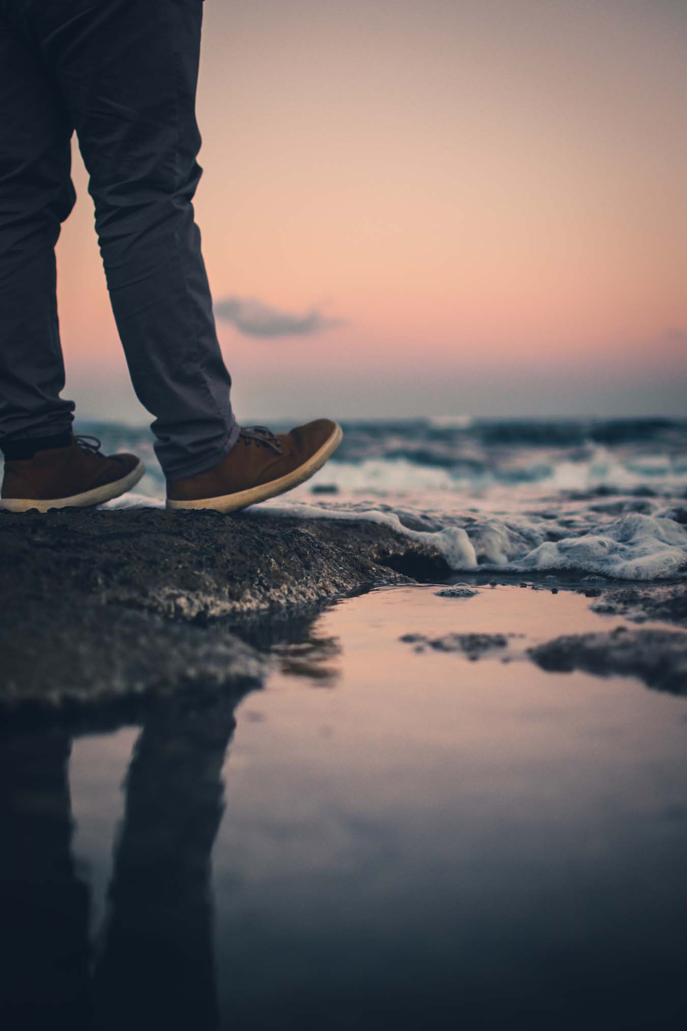 Walk on the beach with foaming spray