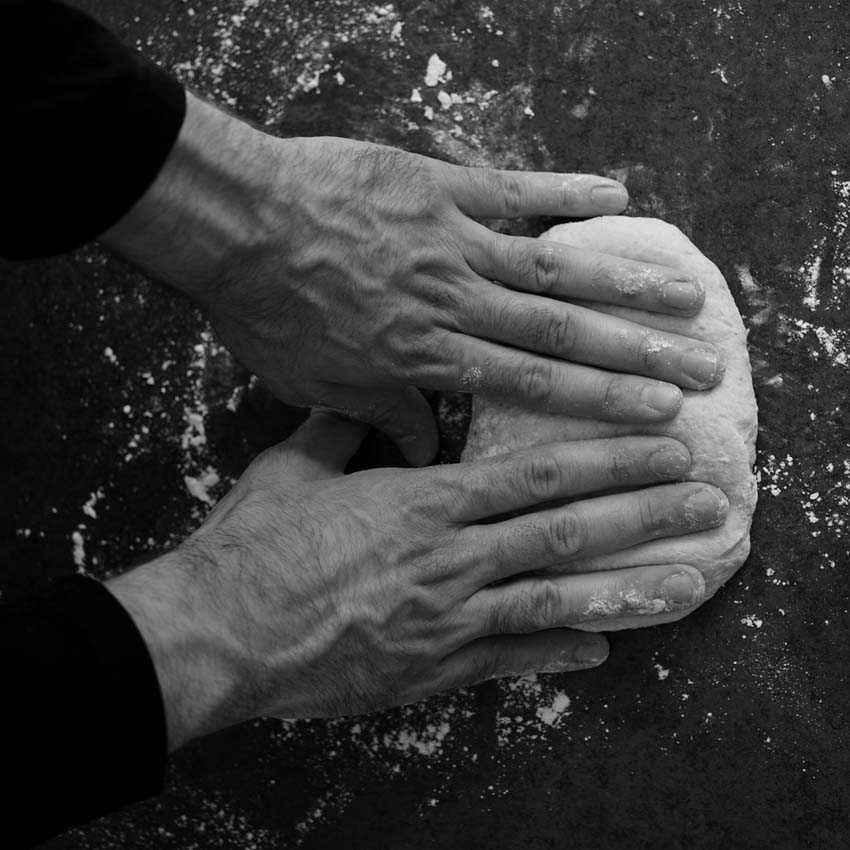 male hands knead dough