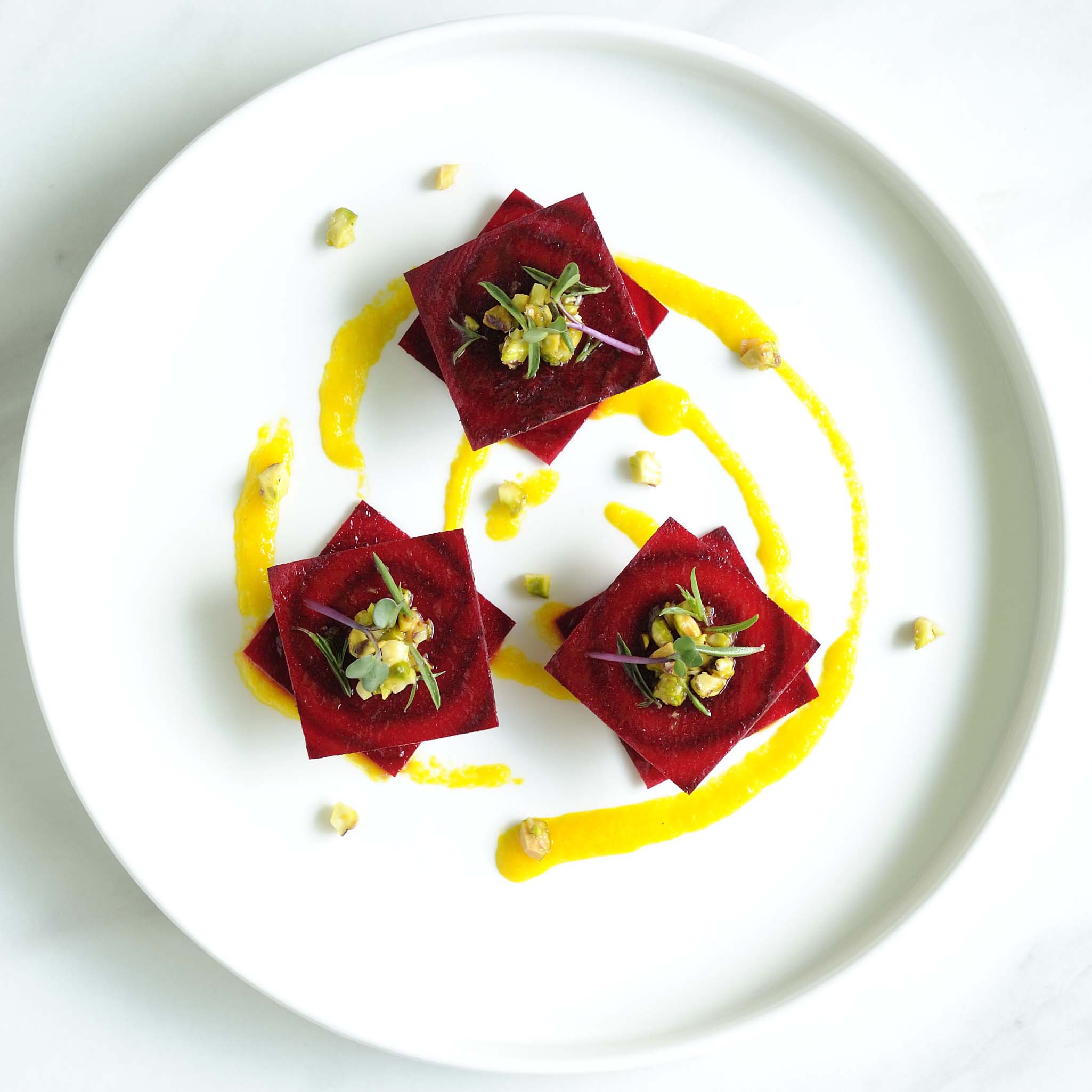 red beet ravioli filled with cashew-cheese